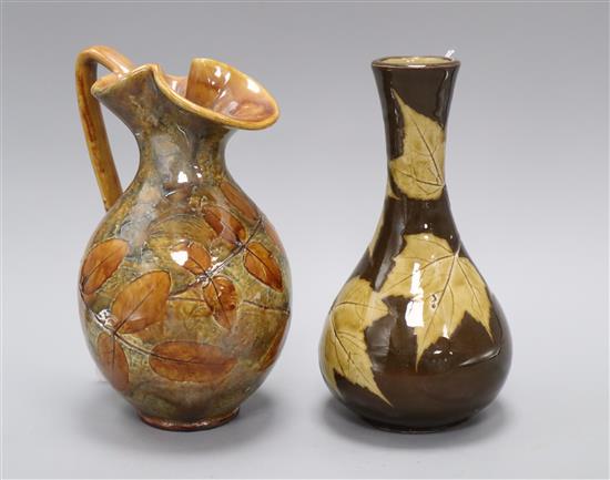 A Doulton Lambeth sycamore leaf bottle vase, c.1885, marks for Eleanor Tosen and AS and a Royal Doulton Autumn Leaves jug, c.1927,